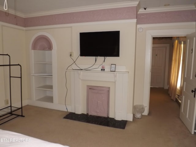 living area featuring carpet flooring, built in features, ornamental molding, and baseboards