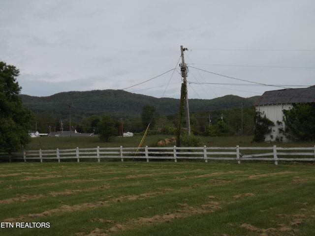 view of yard with a mountain view and a view of countryside