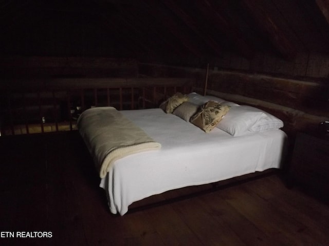 bedroom with wood finished floors
