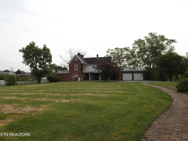 view of front of home featuring a chimney and driveway
