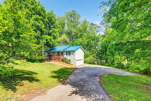 330 Ridgeview Dr, Oliver Springs, TN 37840 - view of front of house with a garage, driveway, and a front lawn