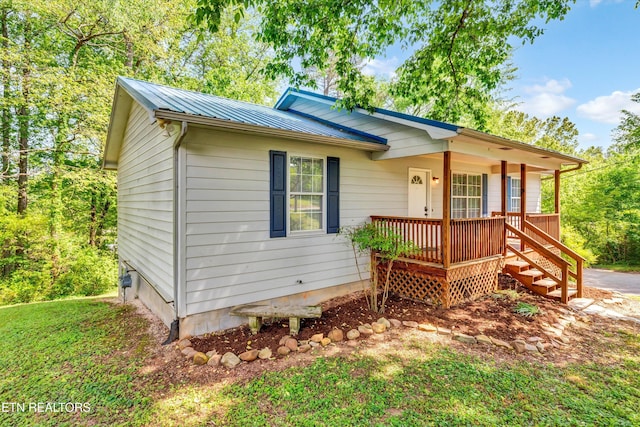 330 Ridgeview Dr, Oliver Springs, TN 37840 - ranch-style house featuring a porch and metal roof