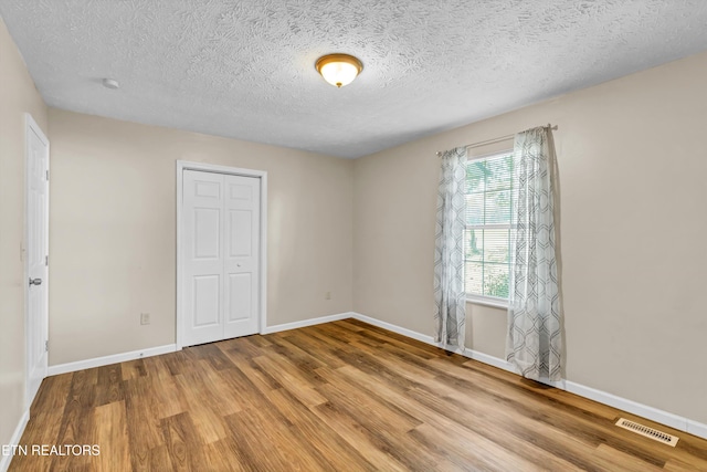 330 Ridgeview Dr, Oliver Springs, TN 37840 - spare room featuring baseboards, visible vents, and wood finished floors