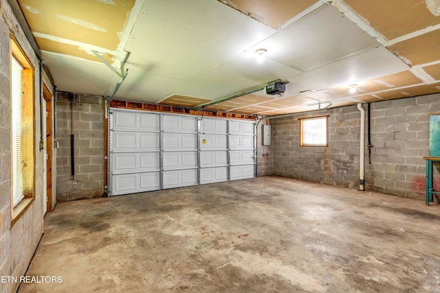 330 Ridgeview Dr, Oliver Springs, TN 37840 - garage with a garage door opener and concrete block wall