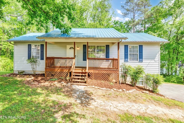 330 Ridgeview Dr, Oliver Springs, TN 37840 - ranch-style house featuring a porch and metal roof