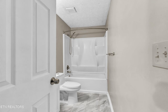 330 Ridgeview Dr, Oliver Springs, TN 37840 - full bathroom with a textured ceiling, shower / washtub combination, baseboards, toilet, and marble finish floor