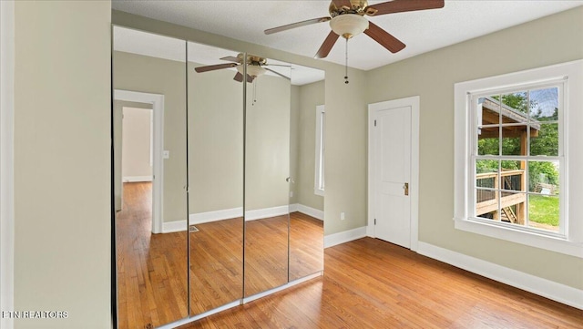 953 Maynard Ave, Knoxville, TN 37917 - unfurnished bedroom featuring wood finished floors, baseboards, ceiling fan, and a closet