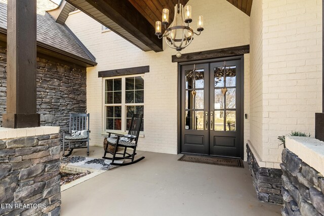 214 Watercrest Dr, Vonore, TN 37885 - view of exterior entry featuring brick siding and french doors