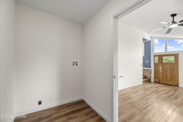 washroom with washer hookup, laundry area, a ceiling fan, baseboards, and wood finished floors