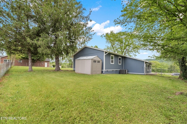 view of yard with fence and cooling unit