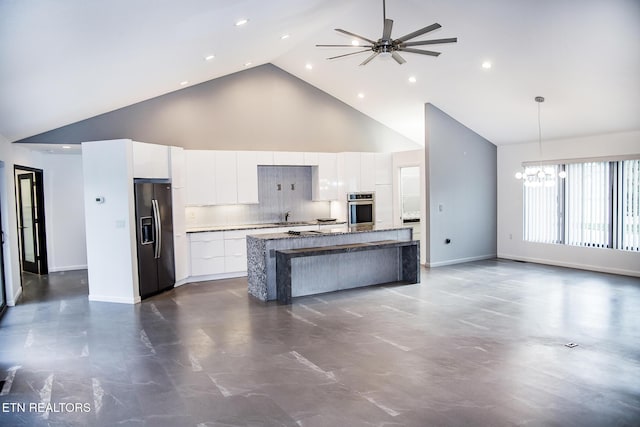 194 Forest View Dr, Crossville, TN 38558 - kitchen with stainless steel oven, modern cabinets, high vaulted ceiling, white cabinetry, and black fridge