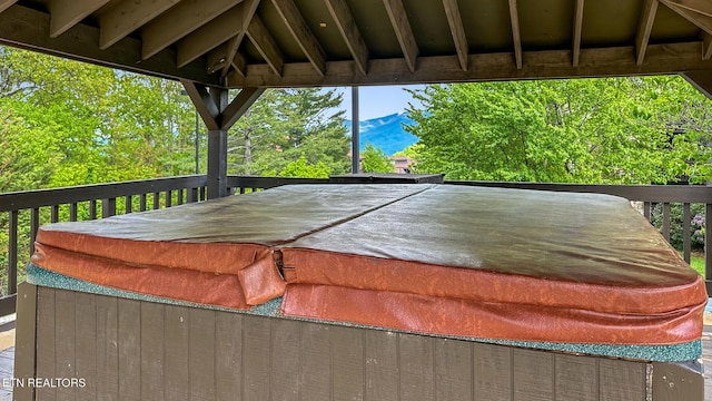 deck featuring a hot tub