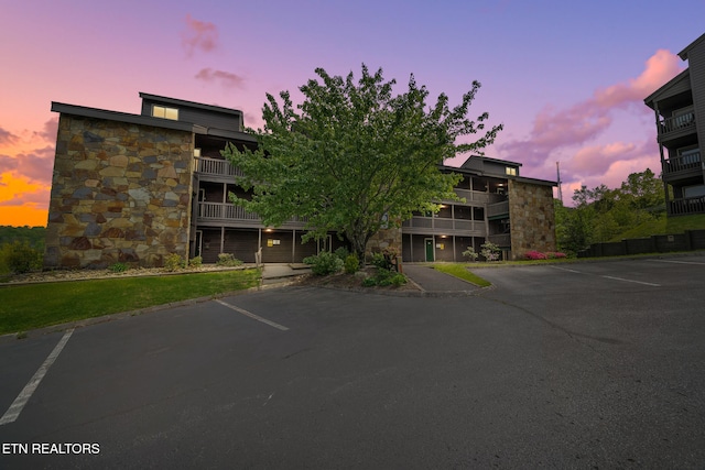 view of property featuring uncovered parking