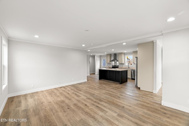 unfurnished living room featuring baseboards and recessed lighting
