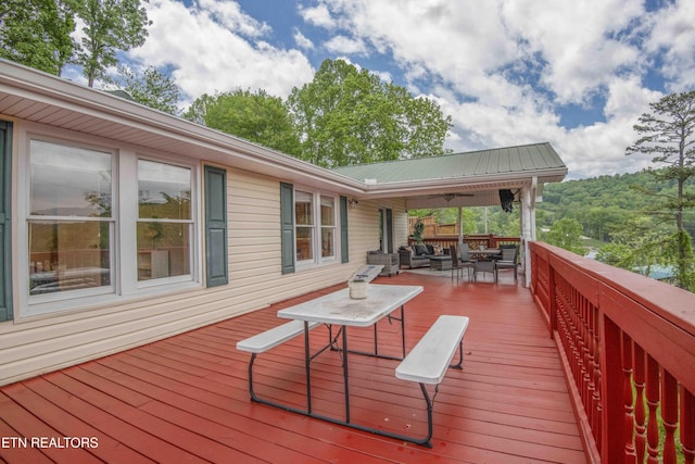 wooden deck featuring an outdoor hangout area
