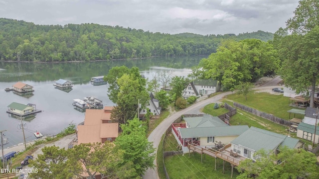 bird's eye view featuring a water view and a wooded view