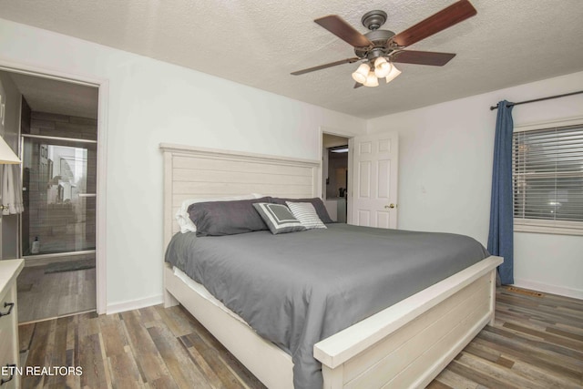 bedroom featuring a ceiling fan, a textured ceiling, and wood finished floors