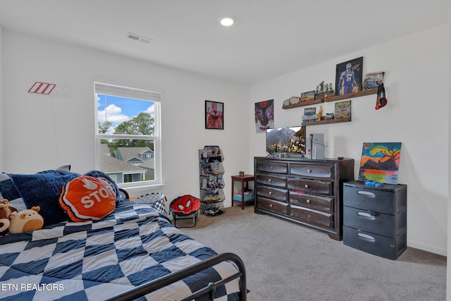 bedroom with recessed lighting, visible vents, and carpet
