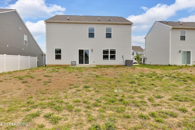 back of property featuring fence and central air condition unit