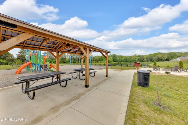 view of home's community featuring a yard and playground community