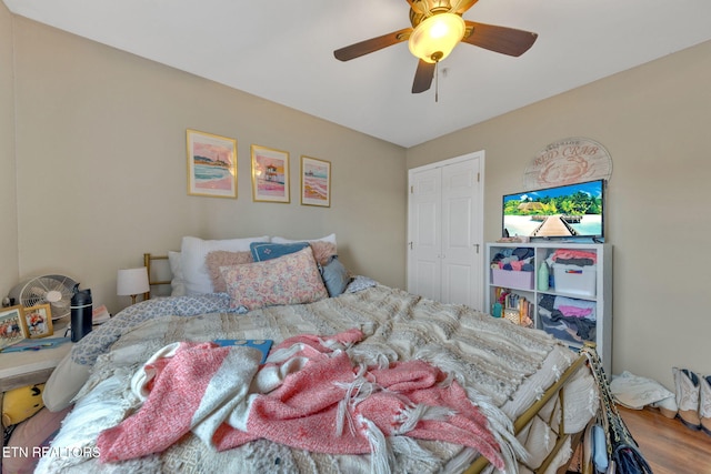 bedroom featuring ceiling fan and wood finished floors