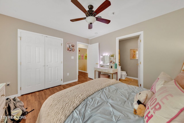 bedroom with baseboards, light wood-style flooring, ceiling fan, and a closet