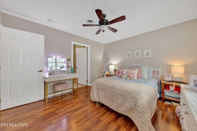 bedroom with ceiling fan and wood finished floors