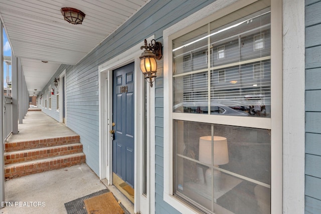 doorway to property featuring covered porch