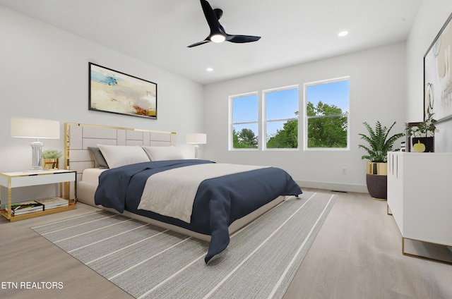 bedroom featuring light wood-style floors, baseboards, a ceiling fan, and recessed lighting