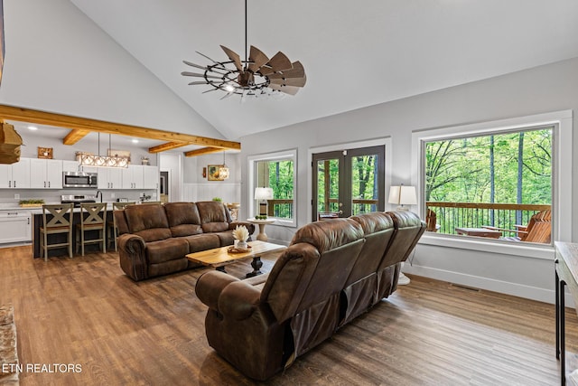 3487 Summit Trails Dr, Sevierville, TN 37862 - living room featuring ceiling fan, high vaulted ceiling, wood finished floors, beamed ceiling, and visible vents