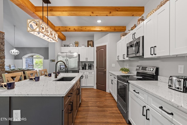 3487 Summit Trails Dr, Sevierville, TN 37862 - kitchen featuring appliances with stainless steel finishes, a sink, dark wood finished floors, white cabinetry, and beamed ceiling