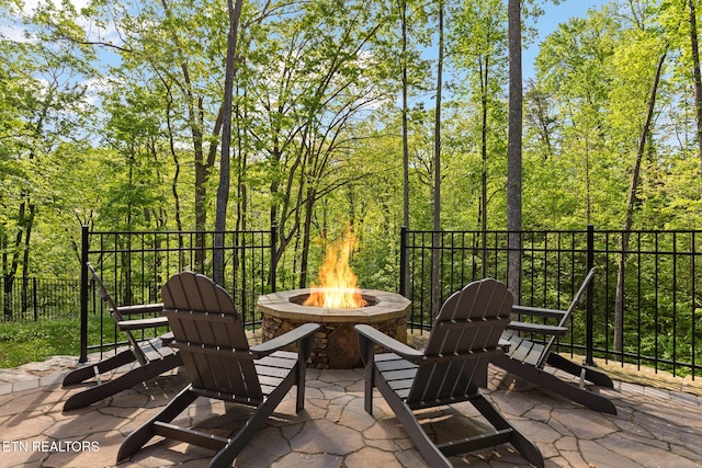 3487 Summit Trails Dr, Sevierville, TN 37862 - balcony with an outdoor fire pit, a patio area, and a forest view
