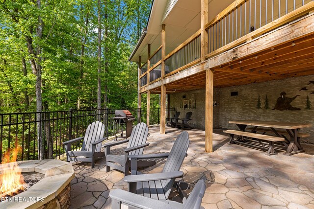 3487 Summit Trails Dr, Sevierville, TN 37862 - view of patio featuring grilling area, fence, and a fire pit
