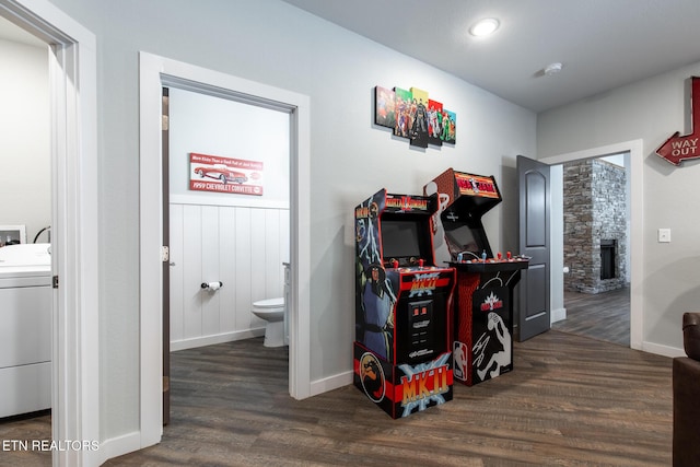 3487 Summit Trails Dr, Sevierville, TN 37862 - interior space featuring baseboards, washer / clothes dryer, wood finished floors, and a stone fireplace