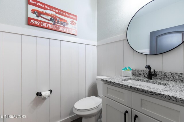 3487 Summit Trails Dr, Sevierville, TN 37862 - bathroom featuring vanity, wainscoting, and toilet