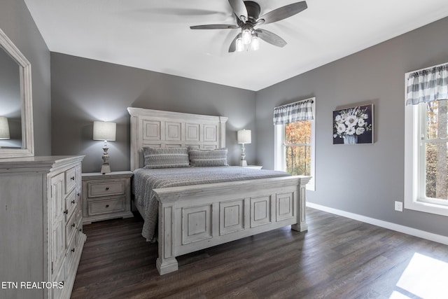 3487 Summit Trails Dr, Sevierville, TN 37862 - bedroom with baseboards, a ceiling fan, and dark wood-style flooring