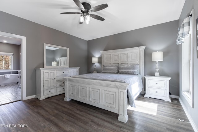 3487 Summit Trails Dr, Sevierville, TN 37862 - bedroom with connected bathroom, a ceiling fan, baseboards, and dark wood-type flooring