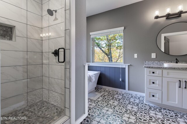 3487 Summit Trails Dr, Sevierville, TN 37862 - full bathroom with a freestanding tub, a shower stall, baseboards, and vanity