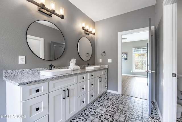 3487 Summit Trails Dr, Sevierville, TN 37862 - full bath with a sink, baseboards, tile patterned floors, and double vanity