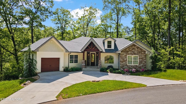 3487 Summit Trails Dr, Sevierville, TN 37862 - view of front of house featuring driveway, a shingled roof, a front yard, and a garage