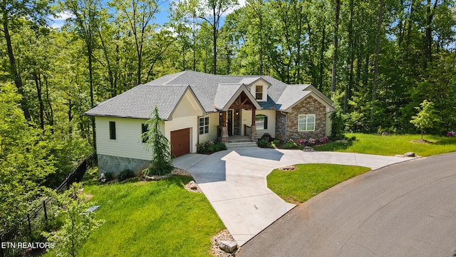 3487 Summit Trails Dr, Sevierville, TN 37862 - view of front facade with a garage, driveway, a front lawn, and stone siding