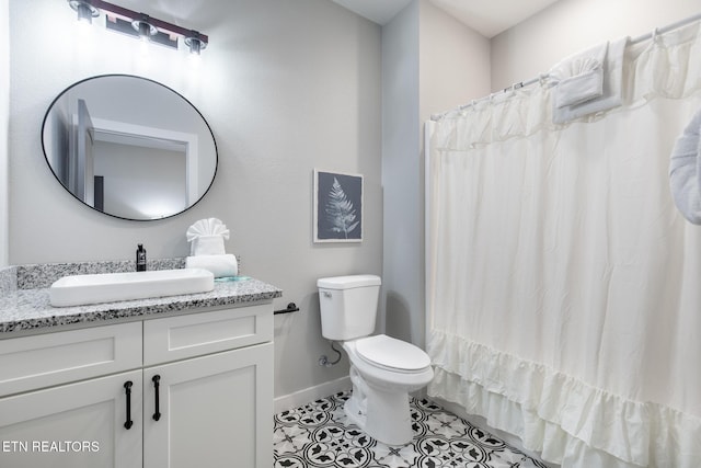 3487 Summit Trails Dr, Sevierville, TN 37862 - full bath with tile patterned flooring, vanity, toilet, a shower with shower curtain, and baseboards