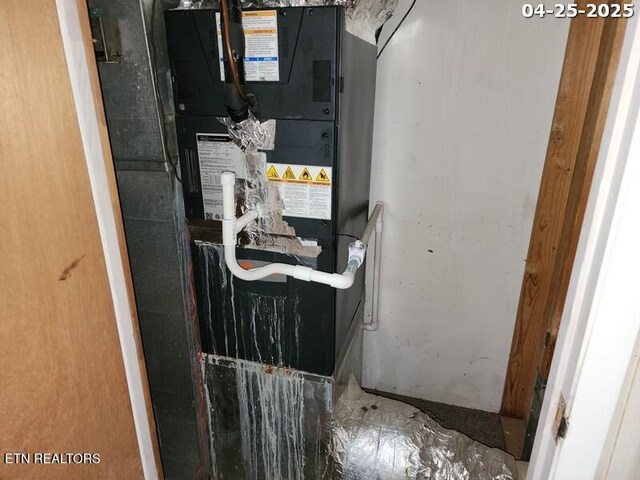 utility room with heating unit