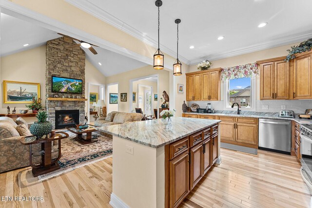 112 Naduli Trl, Vonore, TN 37885 - kitchen featuring light stone countertops, a ceiling fan, open floor plan, and stainless steel appliances
