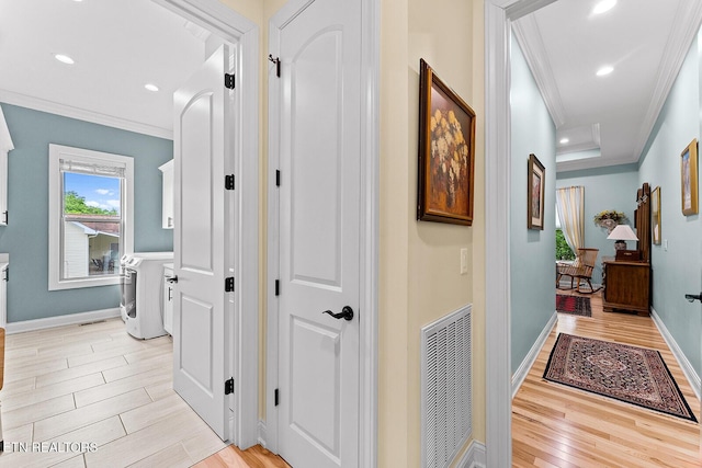 112 Naduli Trl, Vonore, TN 37885 - hall featuring independent washer and dryer, visible vents, baseboards, ornamental molding, and light wood-style flooring