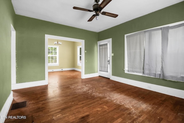 550 Margrave, Harriman, TN 37748 - spare room with visible vents, baseboards, ceiling fan with notable chandelier, and hardwood / wood-style floors