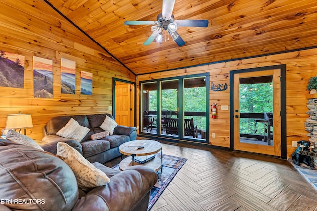 living room featuring wood walls, ceiling fan, wooden ceiling, and vaulted ceiling