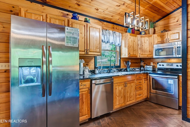 kitchen with a sink, stainless steel appliances, dark stone countertops, wooden ceiling, and vaulted ceiling