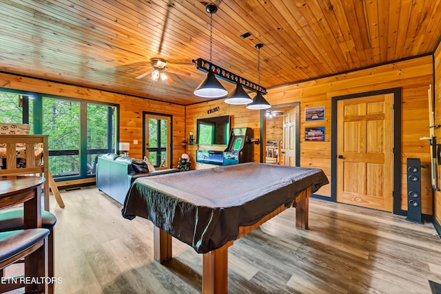 recreation room featuring ceiling fan, wooden walls, light wood-type flooring, and billiards