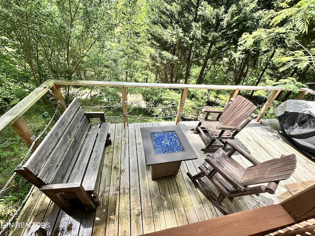 deck with an outdoor fire pit